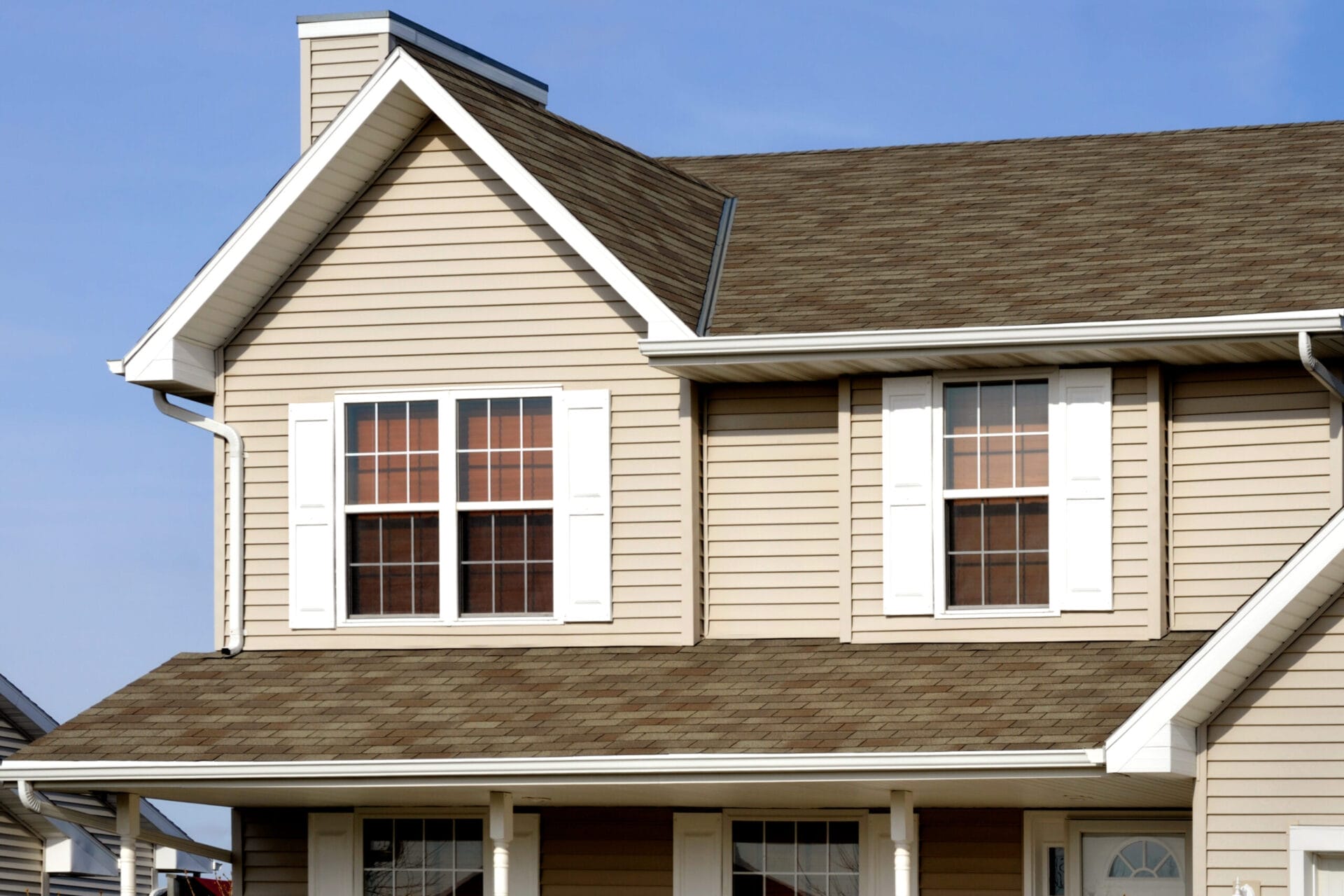 Exterior of a home with white K-style gutters.