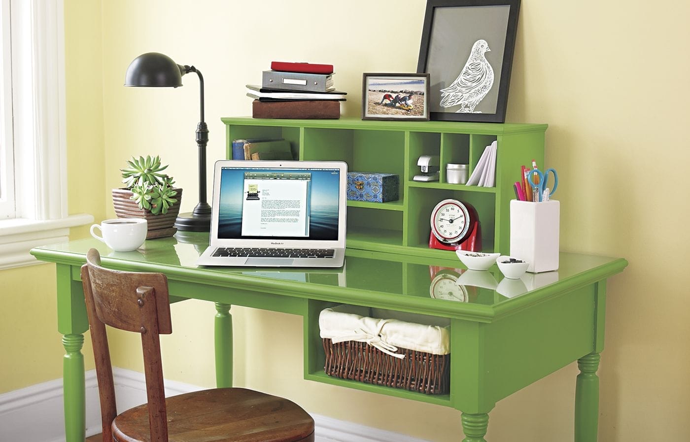 A wooden desk with a storage cubby.