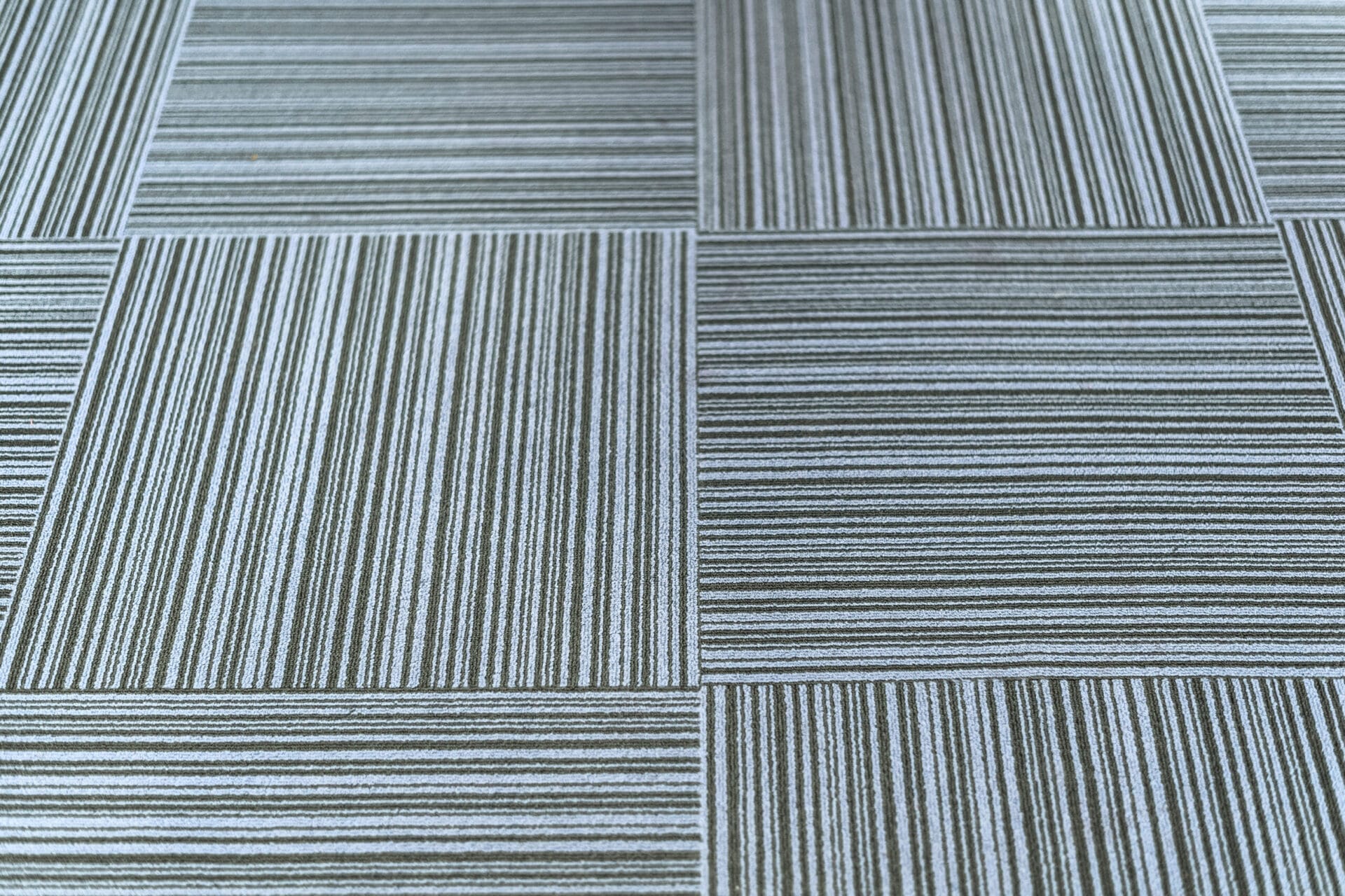 A set of carpet tiles covering a floor.