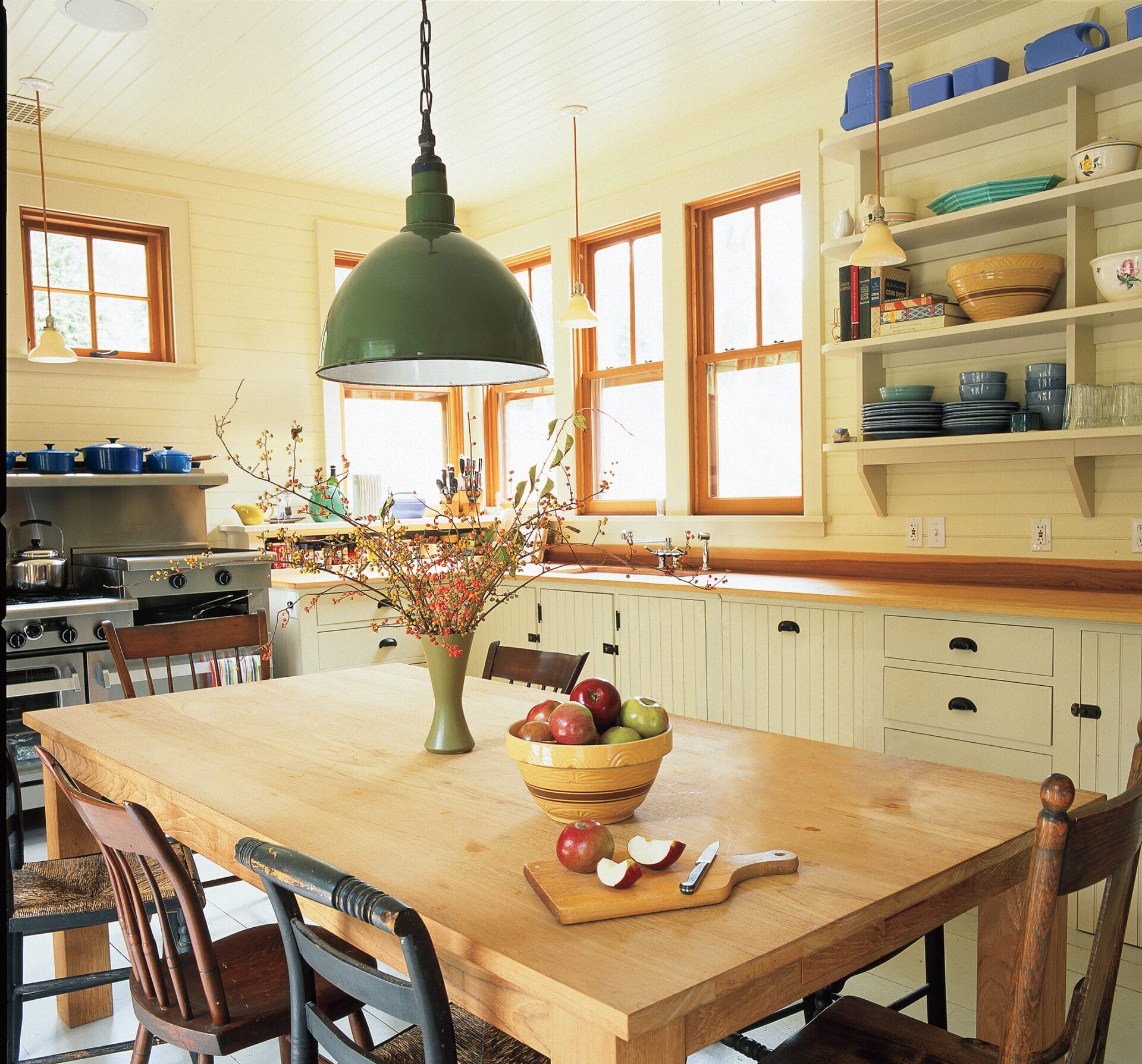 a unique pendant light hanging over a kitchen table