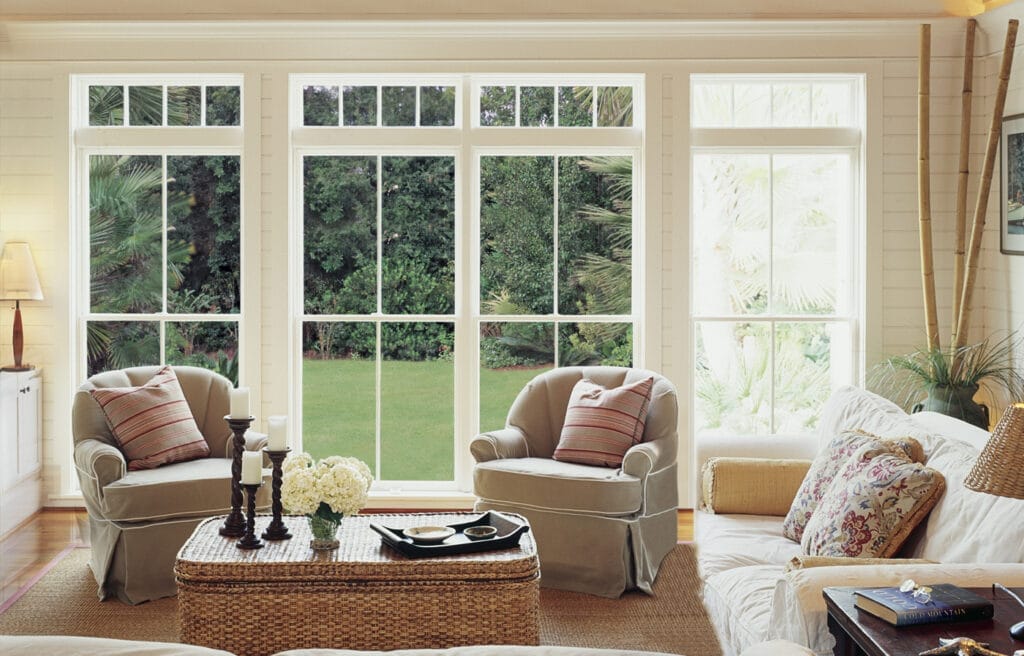 Living room with four wooden windows.