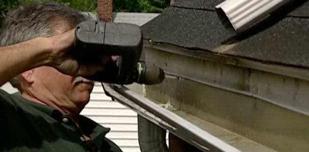 Man repairing a gutter.