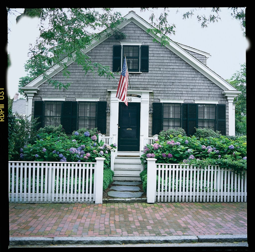 Flag pole installed in front of a home
