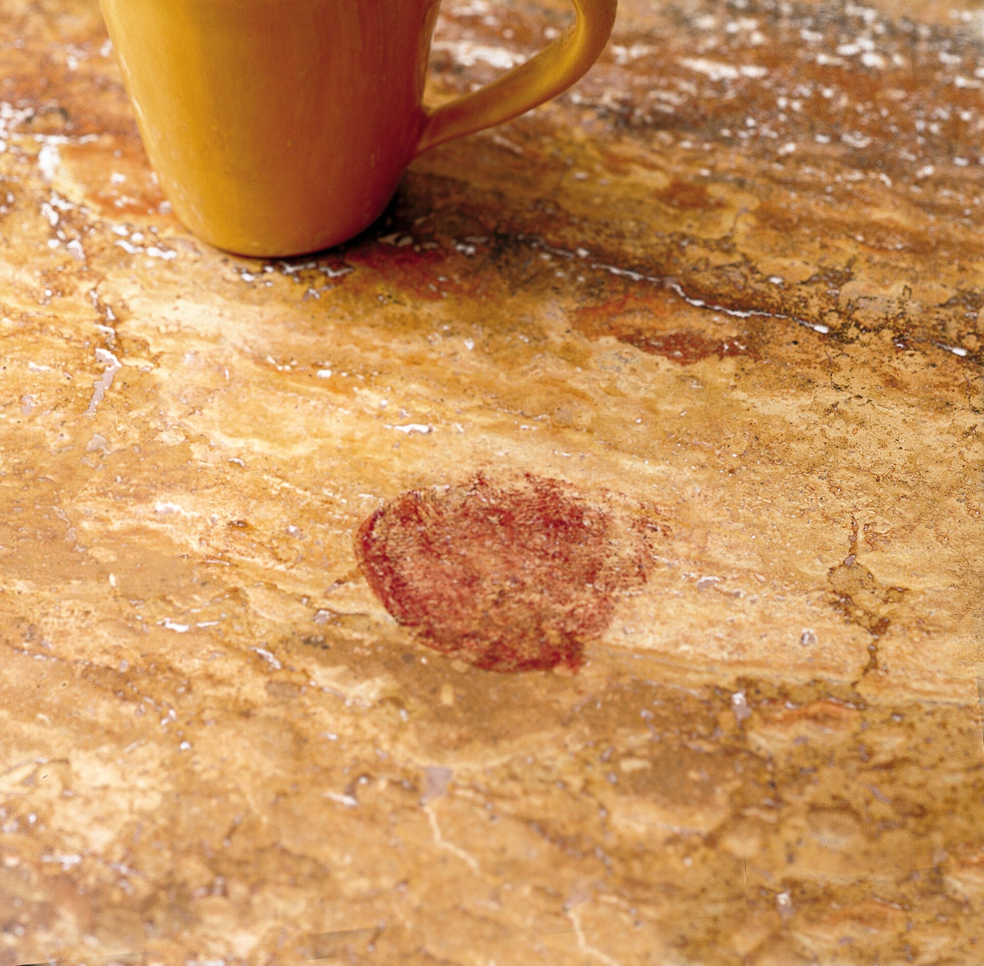 a dark, noticeable stain on a kitchen countertop