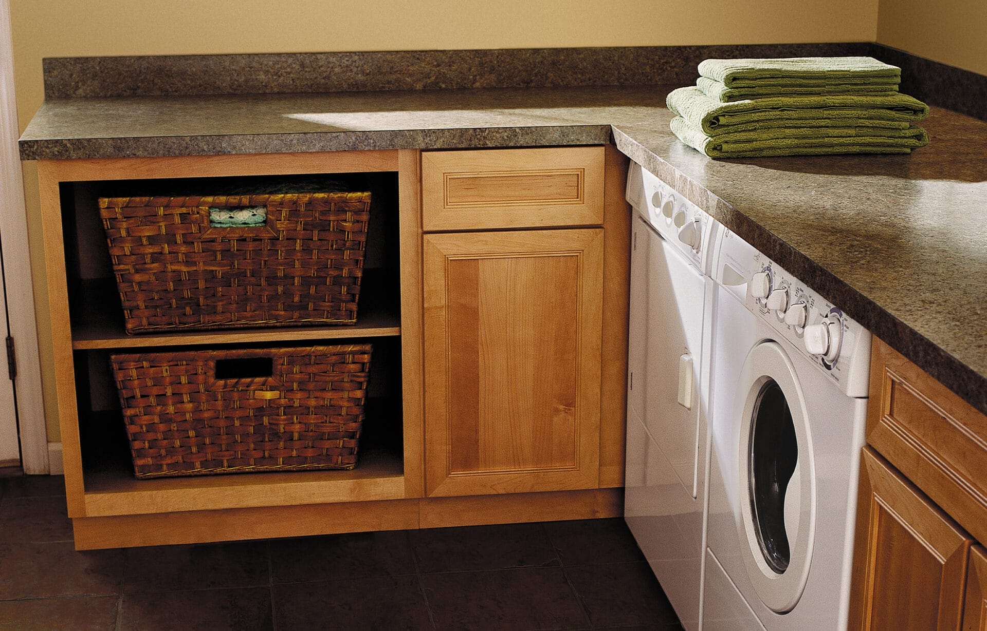 A laundry room with laminate countertops.