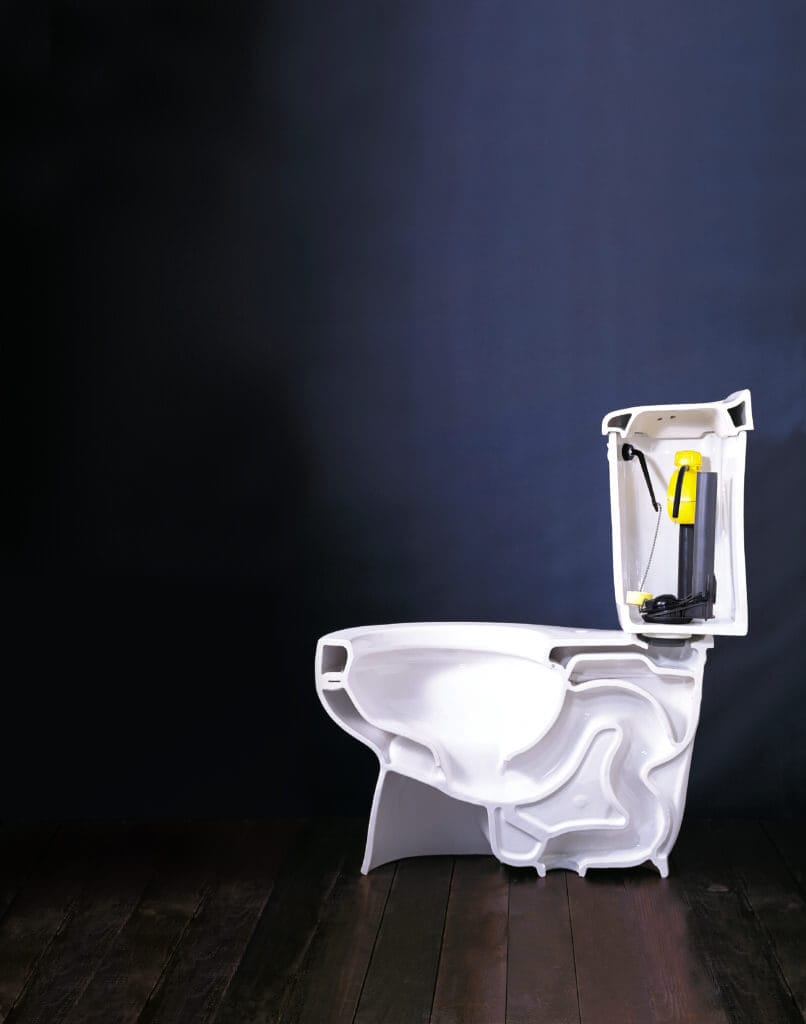 A low flow toilet against a dark blue background.