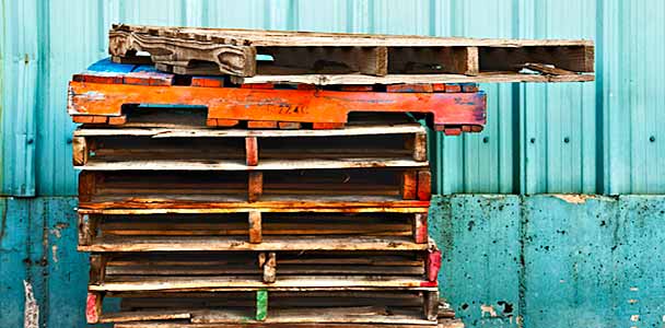 A pile of salvaged wood pallets.