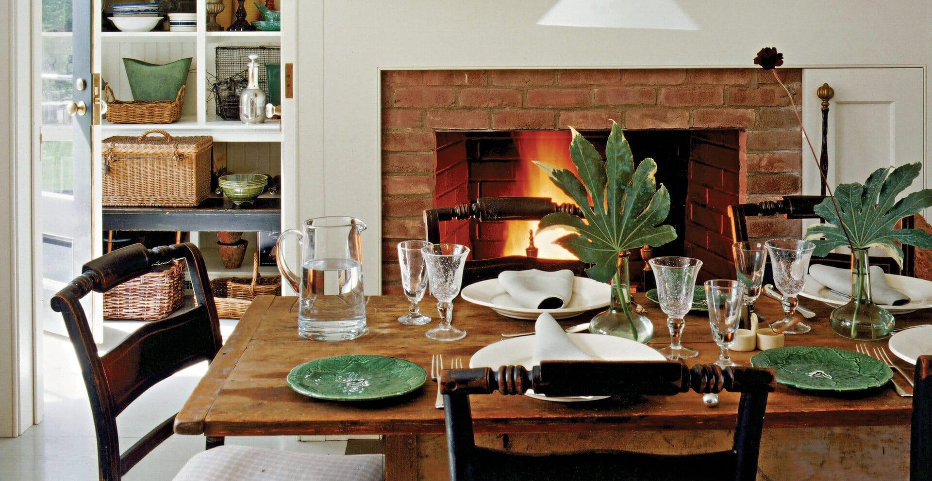 A dining room with a refinished table in the center.
