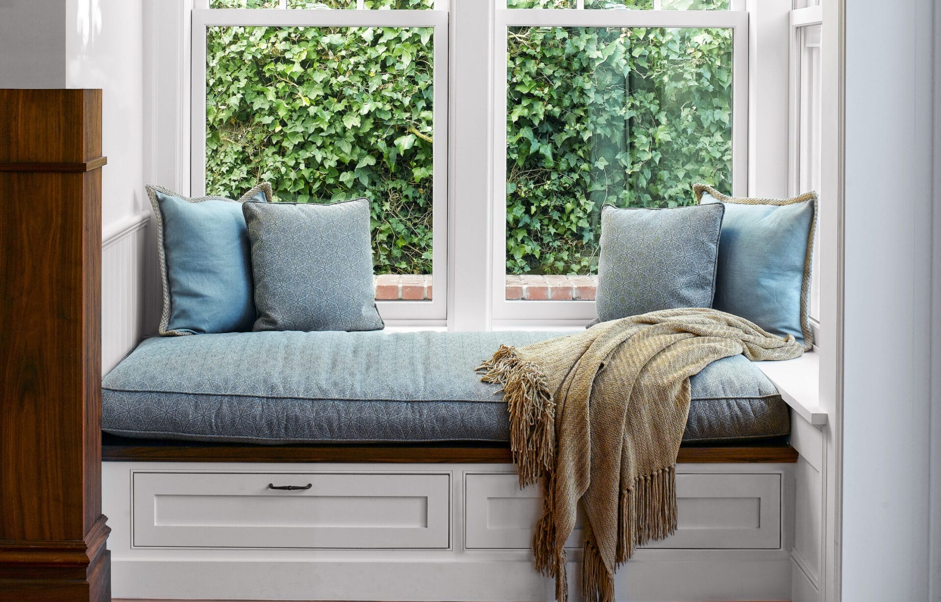 Window seat with blue cushioning