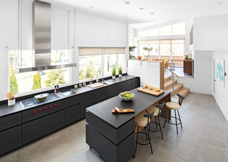 Elevated kitchen view showing open connection to living spaces.