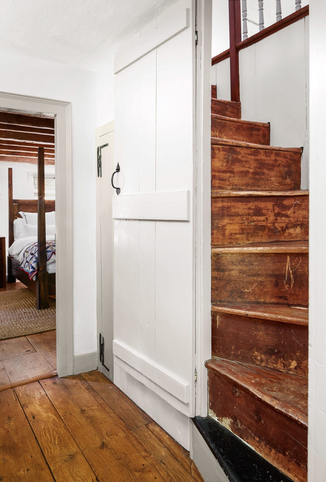 Wooden stairs twisting to the second floor.
