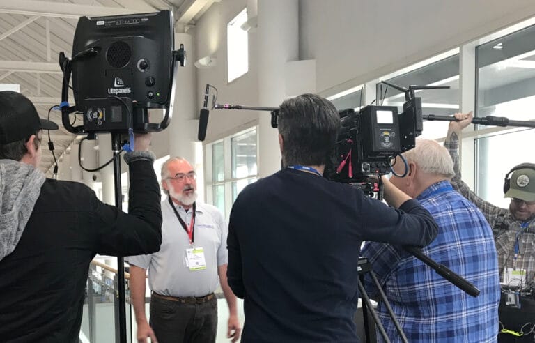 A camera crew recording an interview with a TOH Insider member.