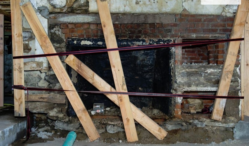 Original beehive oven from 1840 being carefully restored.