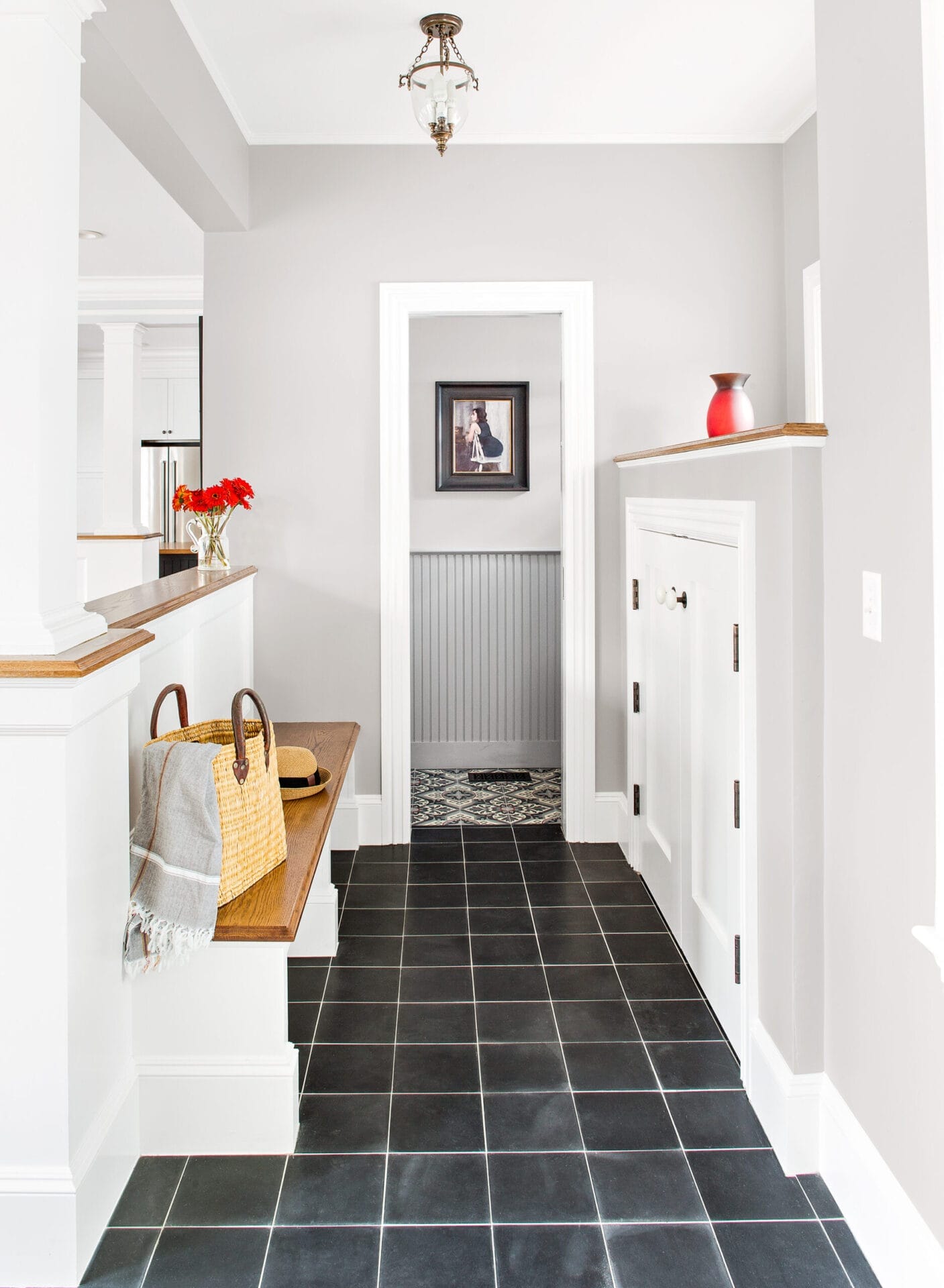 Mudroom bench and storage cabinets with half-wall divider.