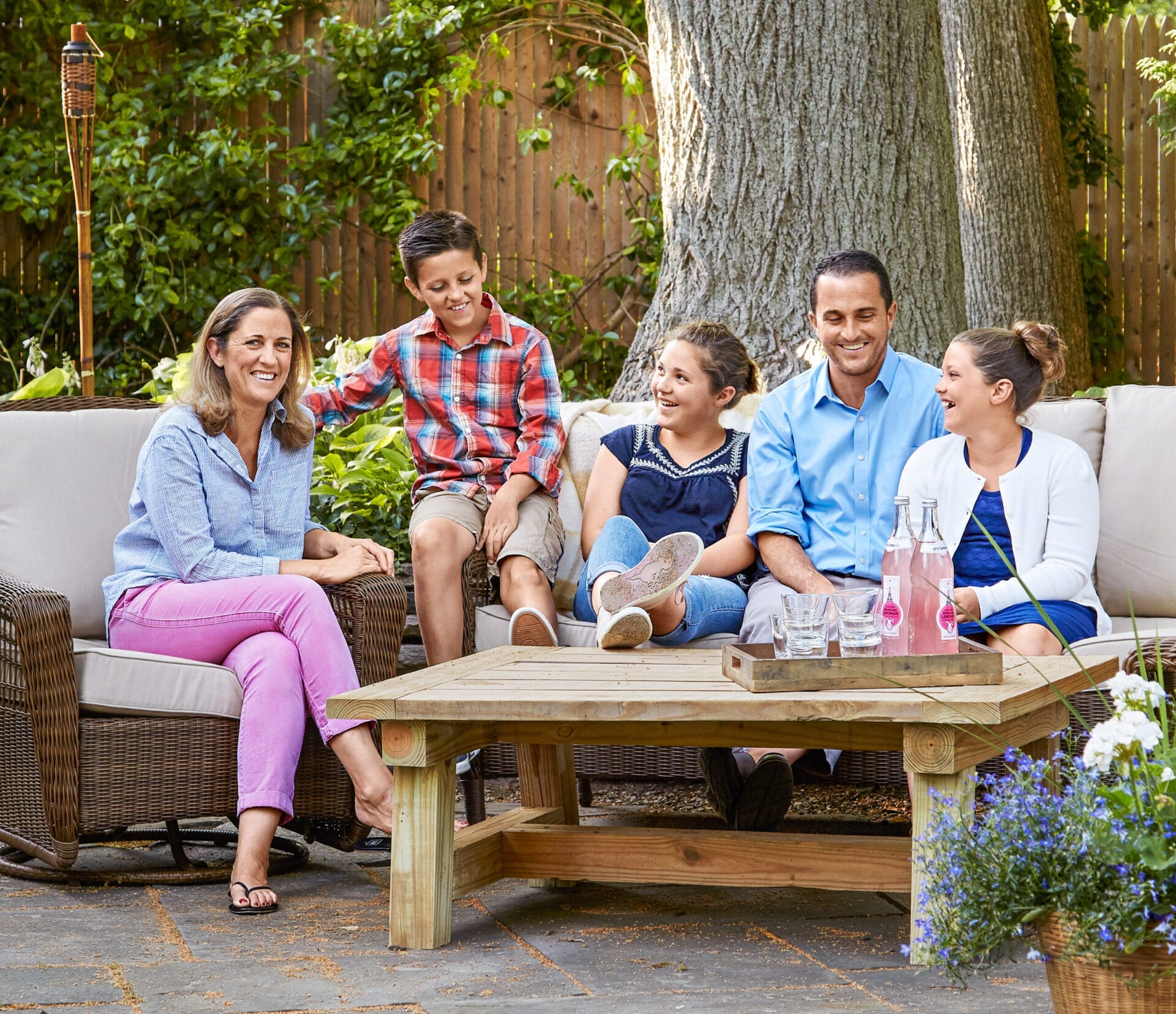 The homeowners and their children enjoying their back patio.