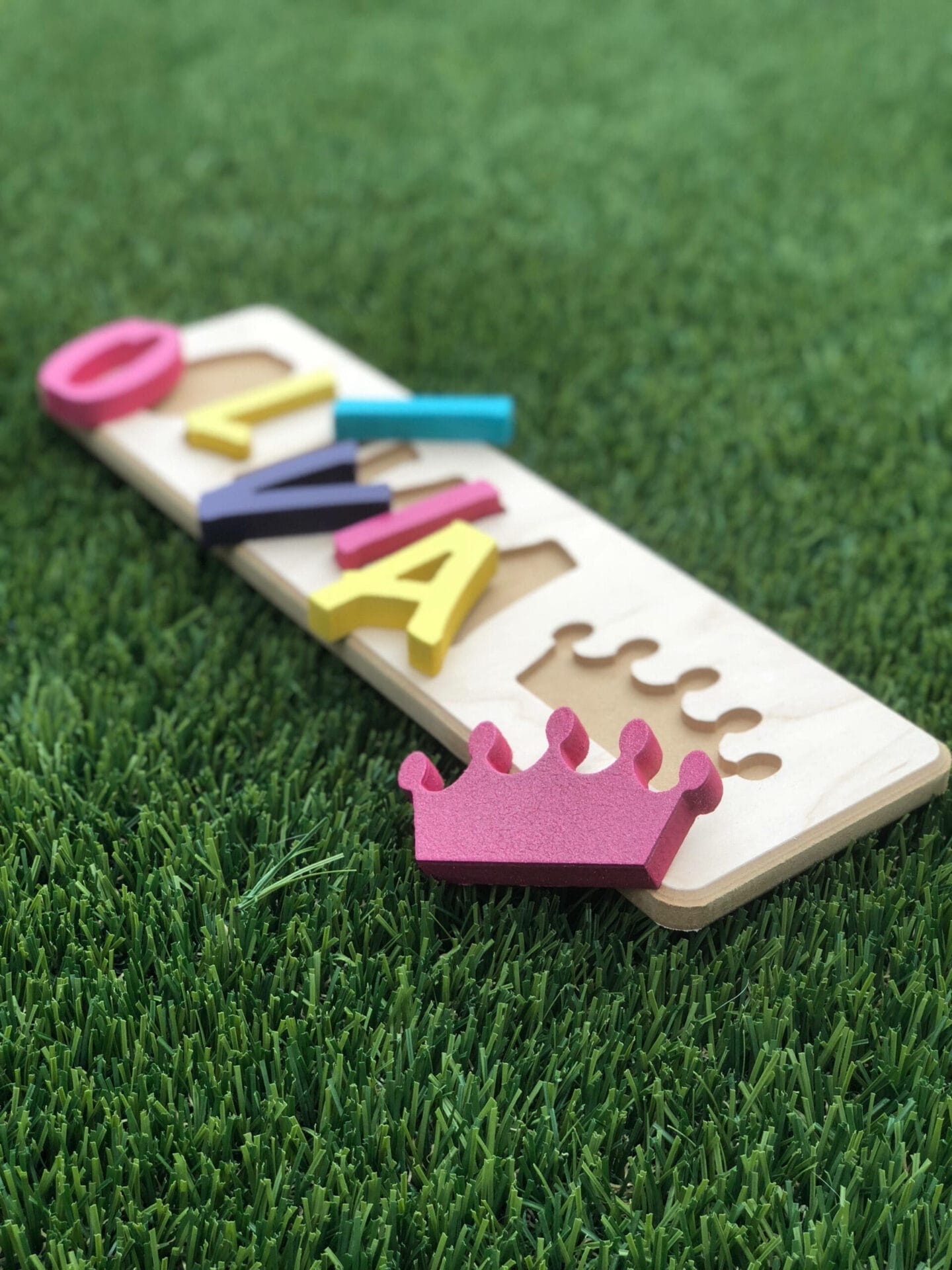 A personalized wooden puzzle of the name "Olivia".