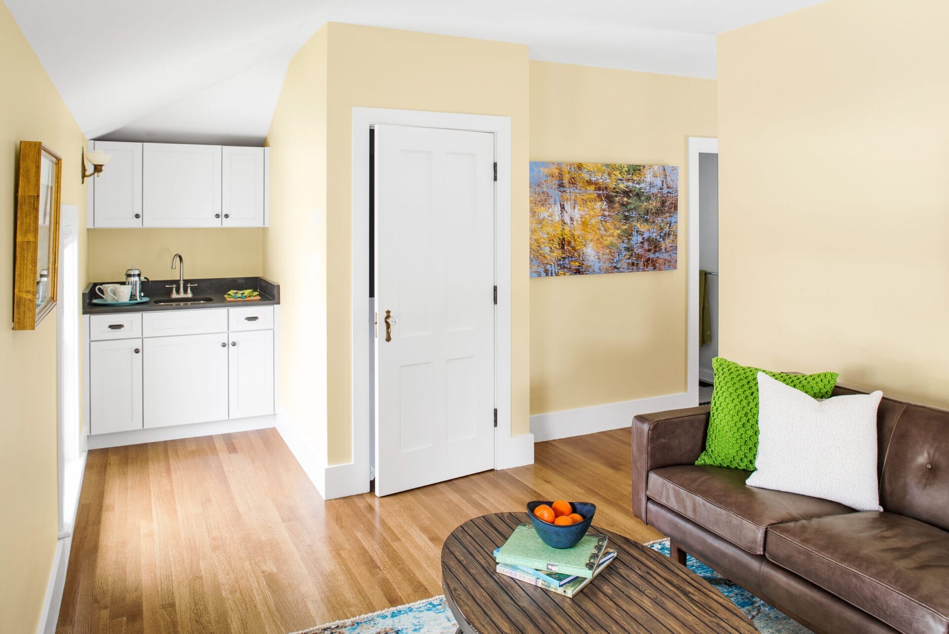 Guest suite wet bar and living area for private retreat.