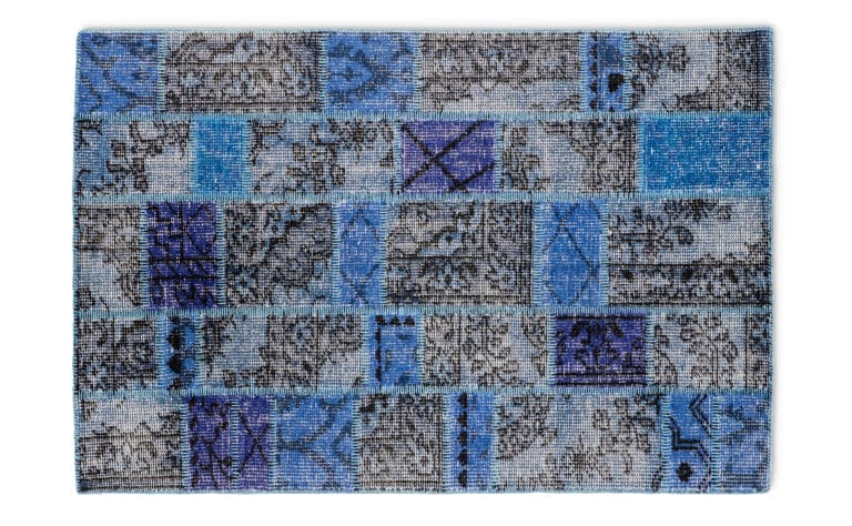 A patchwork rug for a sitting room.