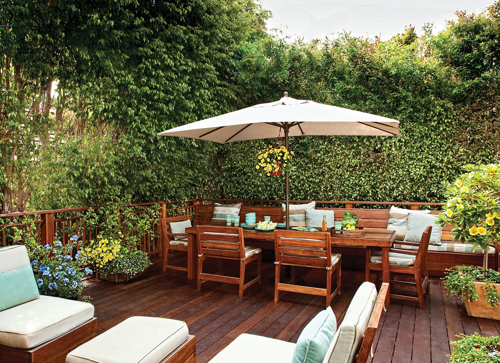 Deck with patio seating area and table and chairs.
