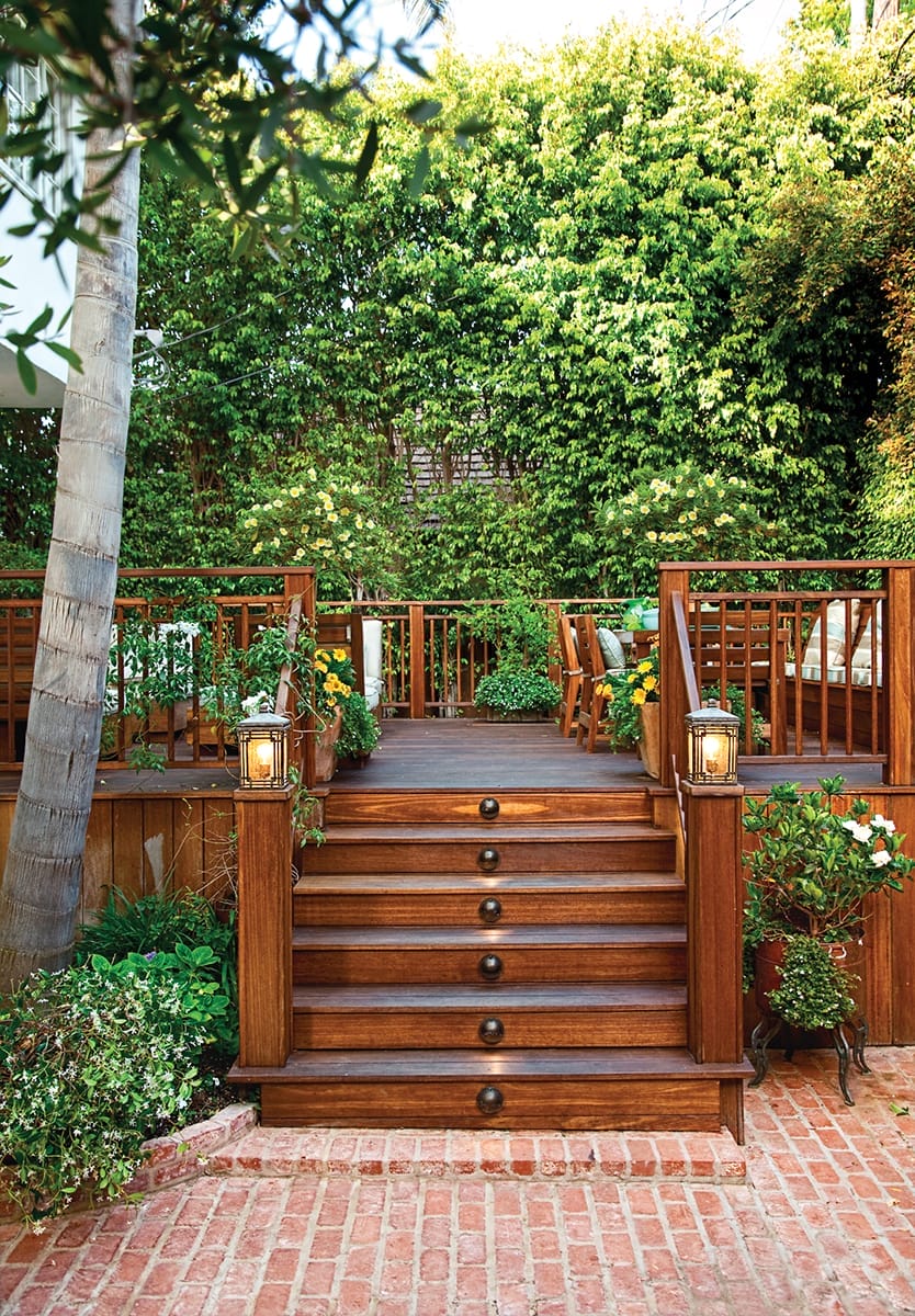 Dark wood steps leading to a deck.