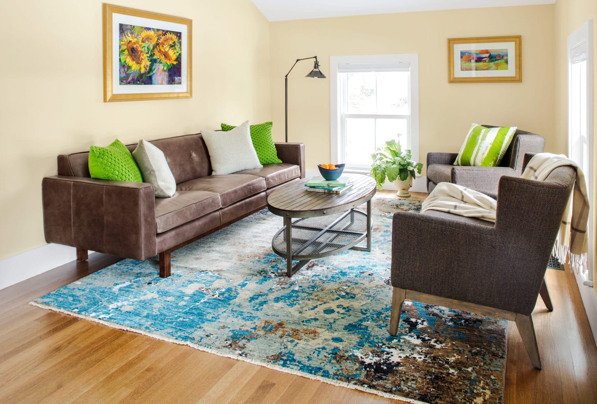 Guest suite sitting room with white oak flooring and airy paint colors.