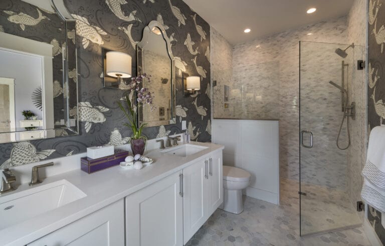 Master bathroom with curbless shower, heated floors, and ocean-motif wallpaper.