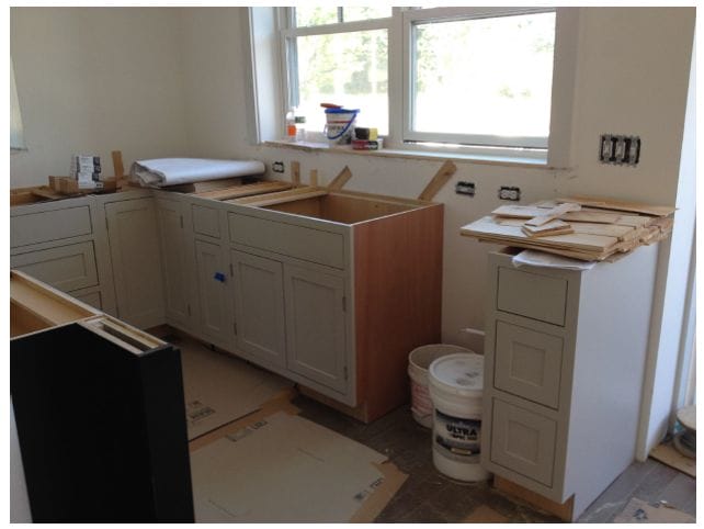 a kitchen that has been gutted of cabinets and new ones will be installed in a remodel.