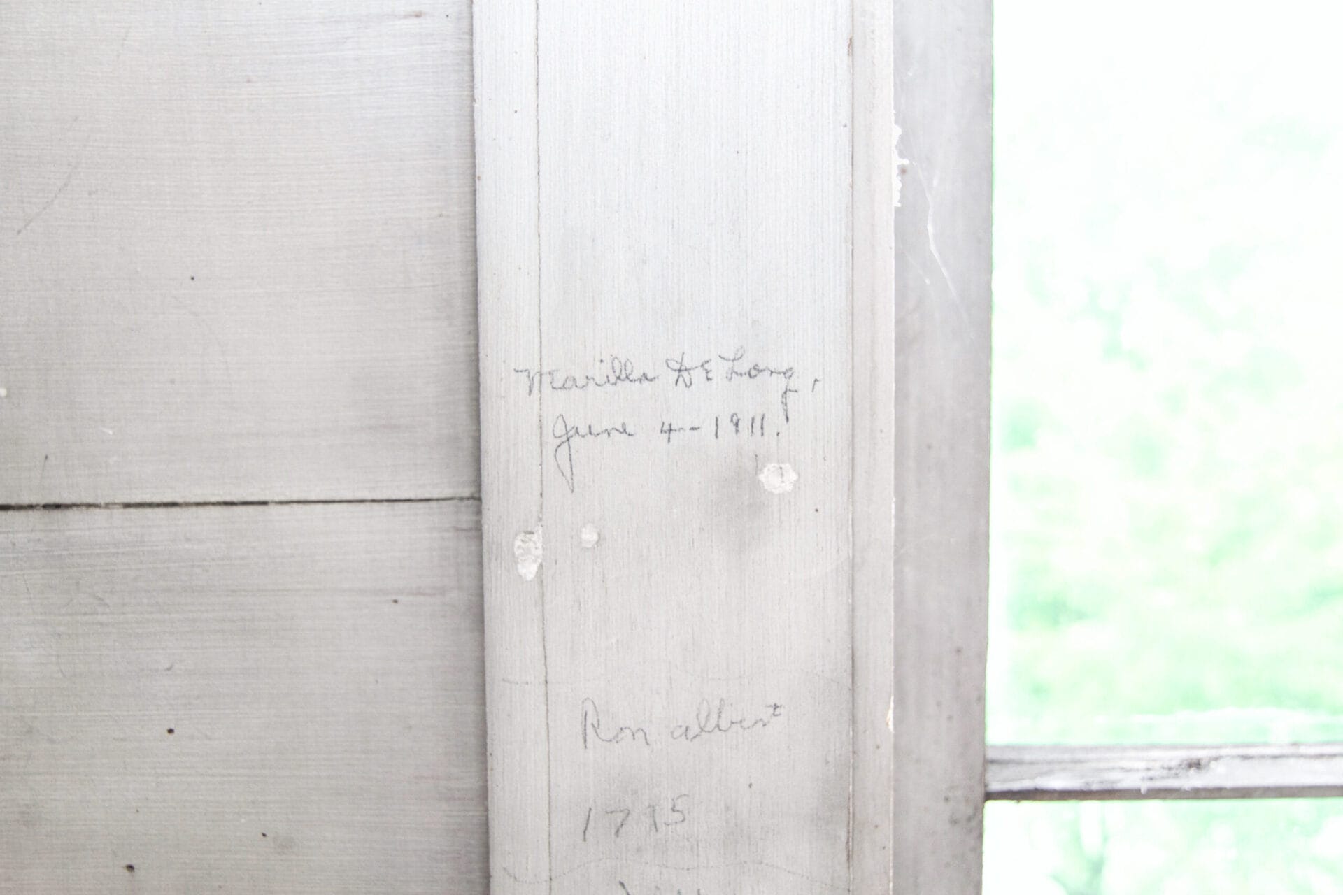Handwritten signatures on the walls.
