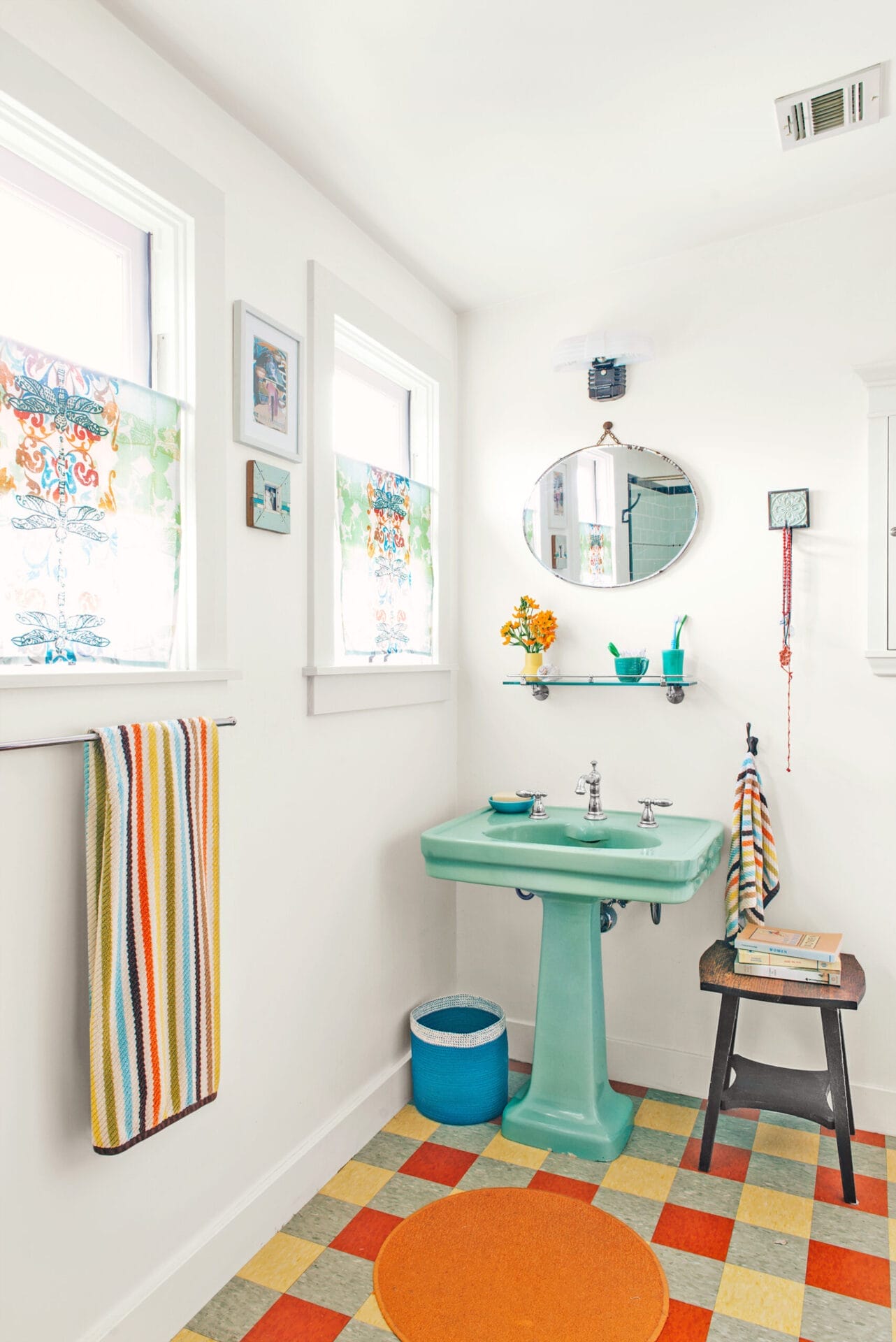 Green salvaged sink in a bathroom.