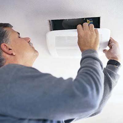 An image of a man picking the proper vent.