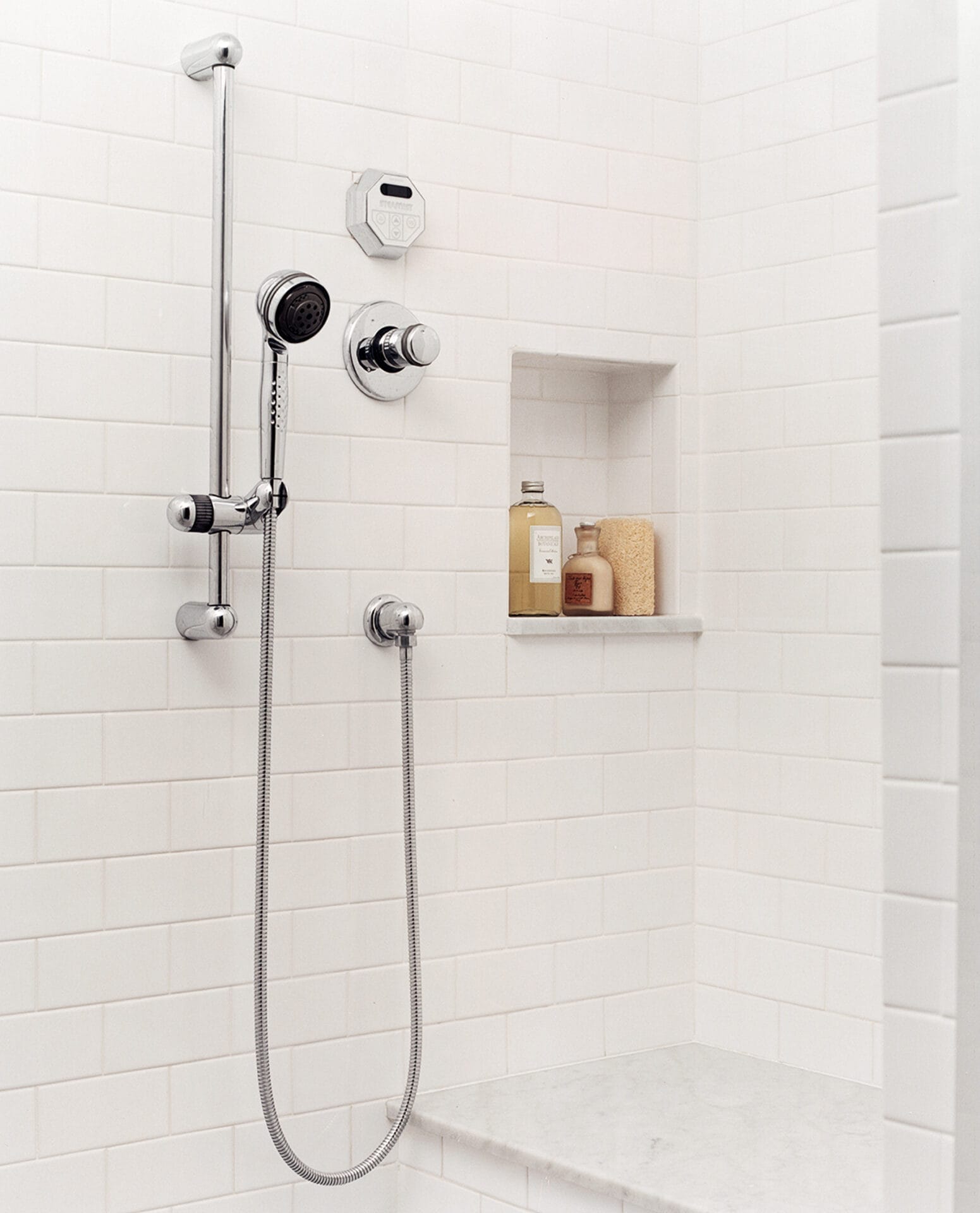 An image of niches in a shower for different toiletries.