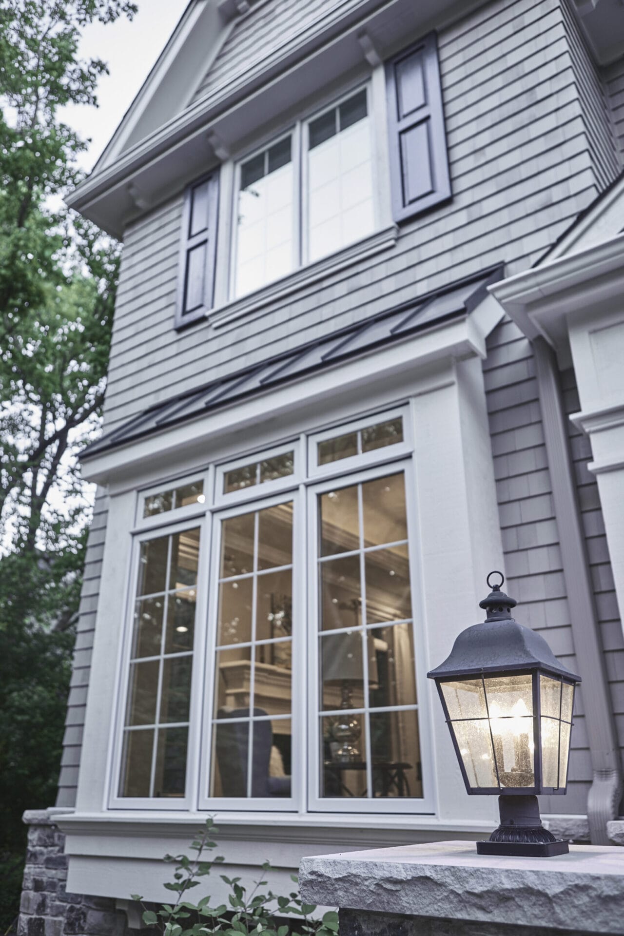 A large set of windows with a grill pattern.