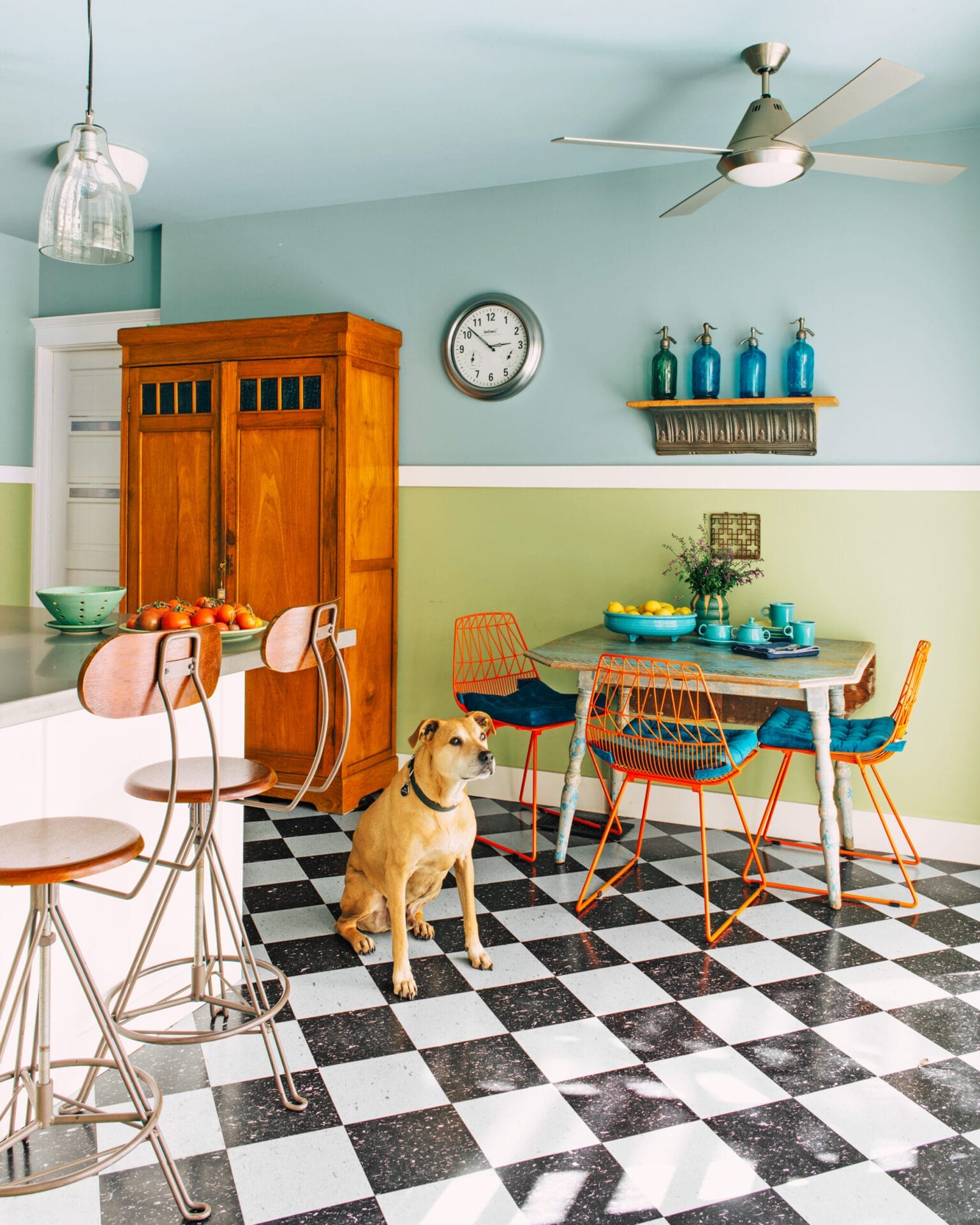 A kitchen table, chairs, and barstools in the kitchen.