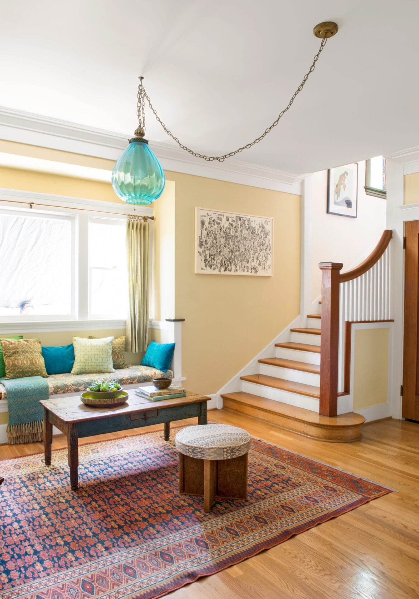 Decorated living room with yellow and turquoise decor.