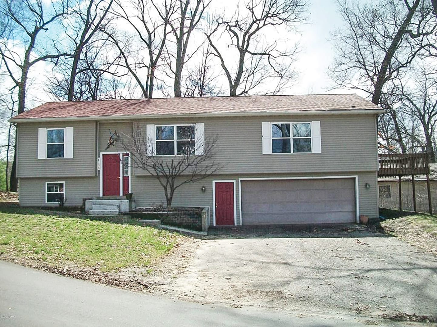 Before photo of a split-level house.