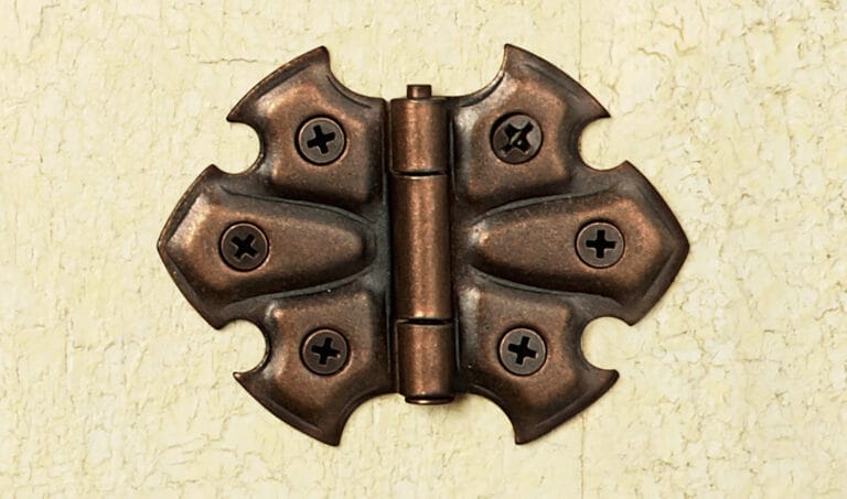 Pointed-leaf butterfly hinge with oil-rubbed bronze finish from circa 1900.
