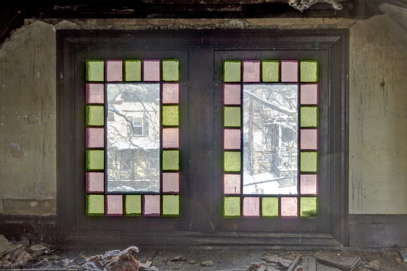 Two stained-glass windows in an attic
