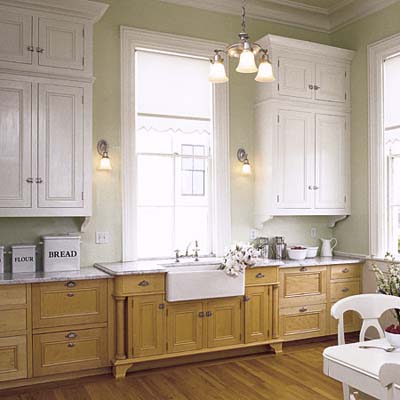 multiple lights around a kitchen including an overhead light and wall sconces