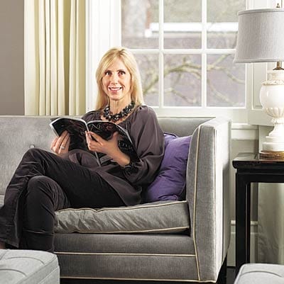 Interior designer Stephanie King sitting on a sofa.
