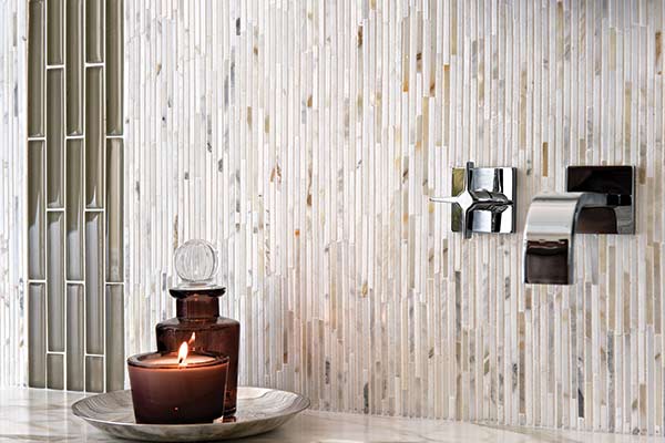 Image of rectangular mosaic tiles stacked vertically on a bathroom wall