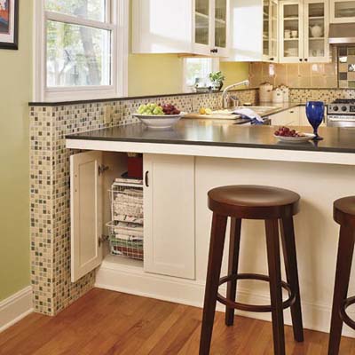 Kitchen peninsula with bar stools.