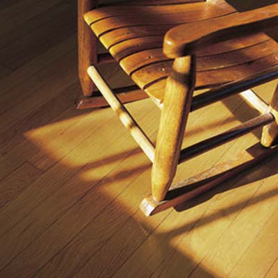 a rocking chair on a wood floor