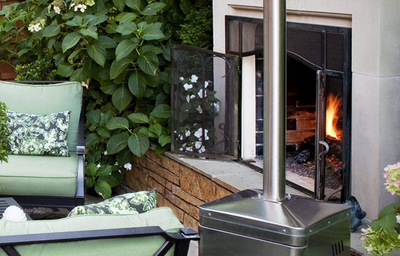 Outdoor patio with a fireplace. 