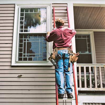 A man working on an extension ladder