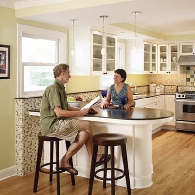 Two people in a kitchen.