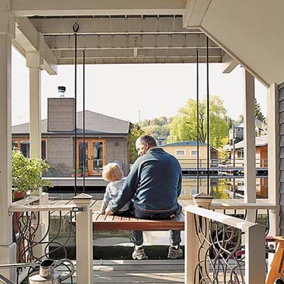 A porch swing on the houseboat deck