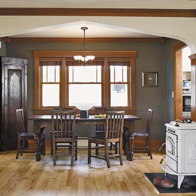 A dining room with a table and chairs