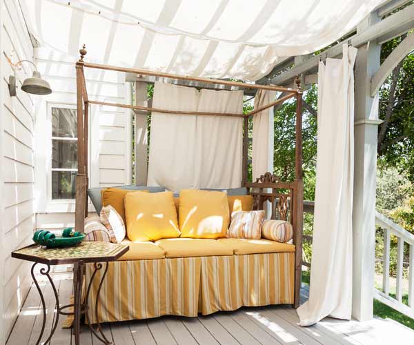 A deck with a tarp canopy.