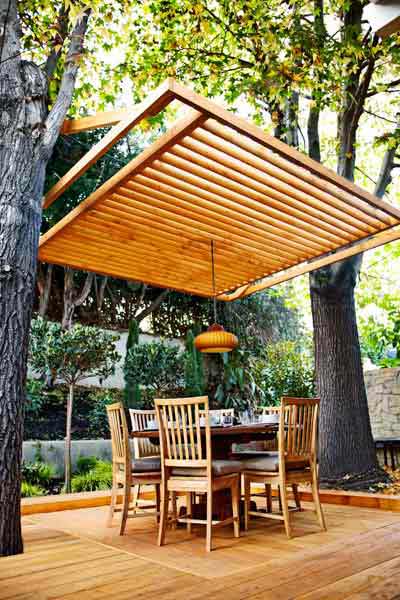 A deck that utilizes trees as a part of it's design.