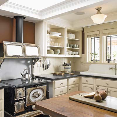 A kitchen with open shelving and an island